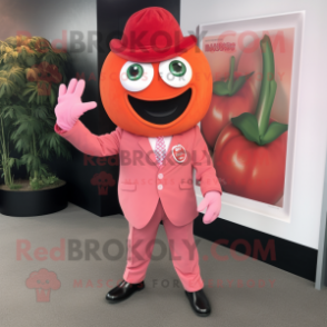 Pink Tomato mascot costume character dressed with a Blazer and Gloves