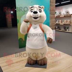 Cream Marmot mascot costume character dressed with a Yoga Pants and Ties