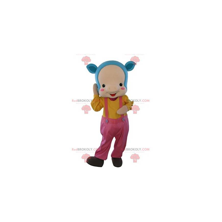 Mascotte de cochon rose avec les cheveux bleus et une salopette