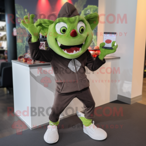 Olive Vampire mascot costume character dressed with a Joggers and Brooches