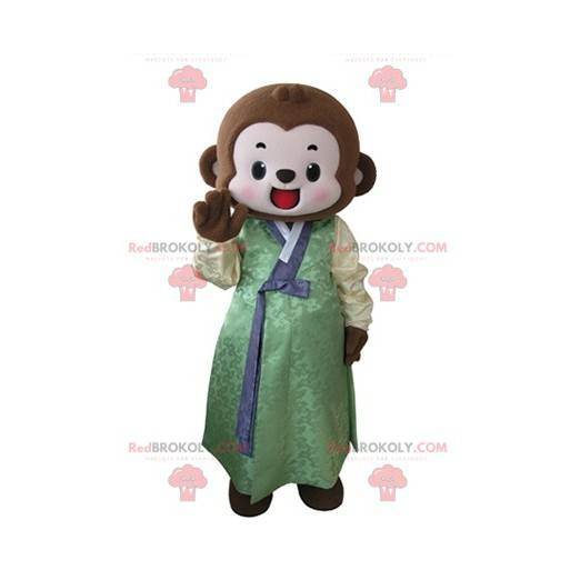 Brown monkey mascot dressed in a yellow and green tunic -