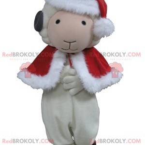 Mascota de cabra oveja blanca y negra en traje de Navidad -