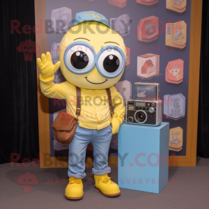 Lemon Yellow Camera mascot costume character dressed with a Chambray Shirt and Wallets