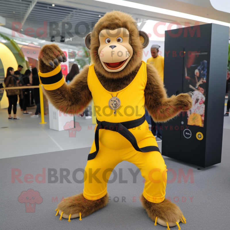 Yellow Baboon mascot costume character dressed with a Yoga Pants and Belts