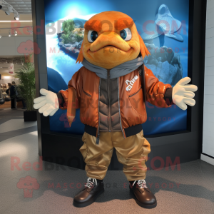 Brown Goldfish mascot costume character dressed with a Bomber Jacket and Gloves