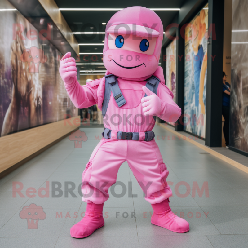 Pink Commando mascot costume character dressed with a Jeans and Anklets