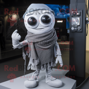 Silver Camera mascot costume character dressed with a Skinny Jeans and Shawl pins