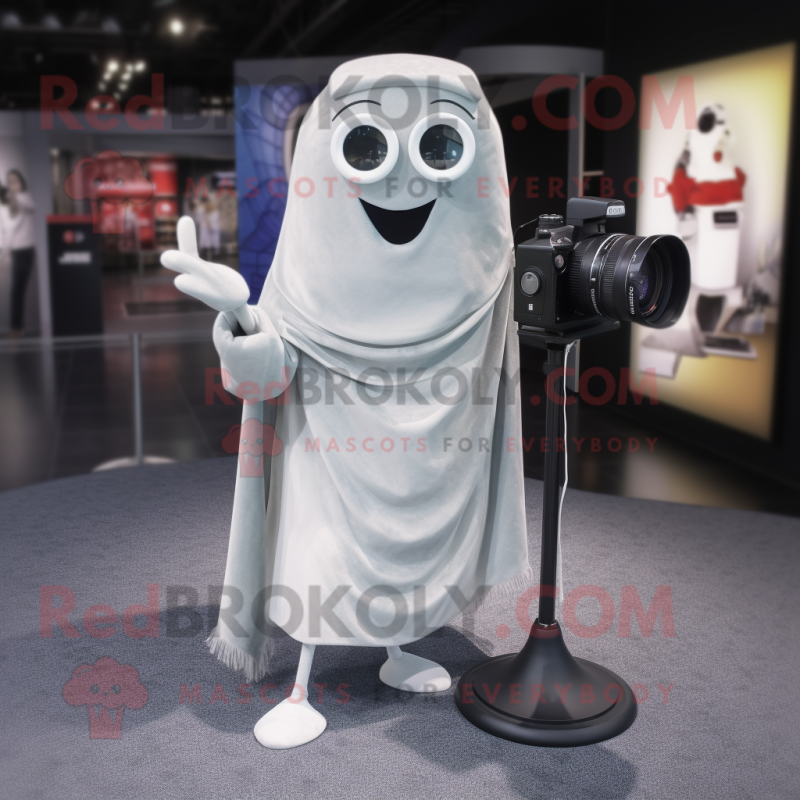 Silver Camera mascot costume character dressed with a Skinny Jeans and Shawl pins