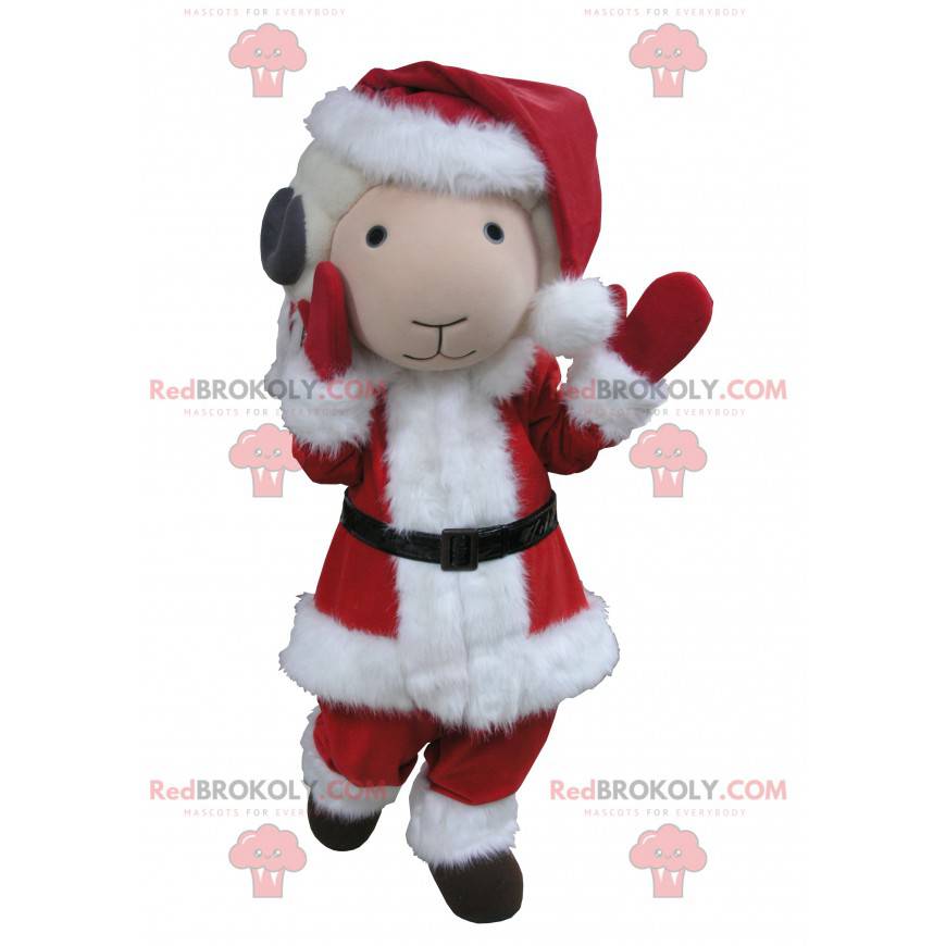 Mascota de cabra blanca y gris vestida como Santa Claus -