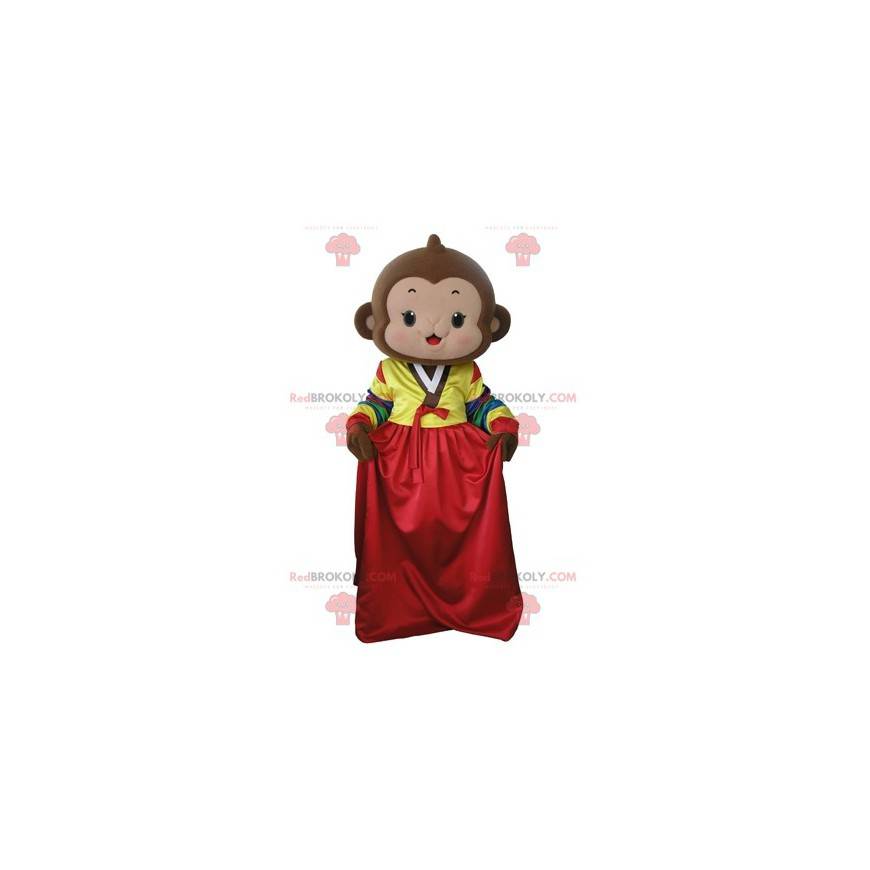 Brun abe maskot med en farverig kjole - Redbrokoly.com