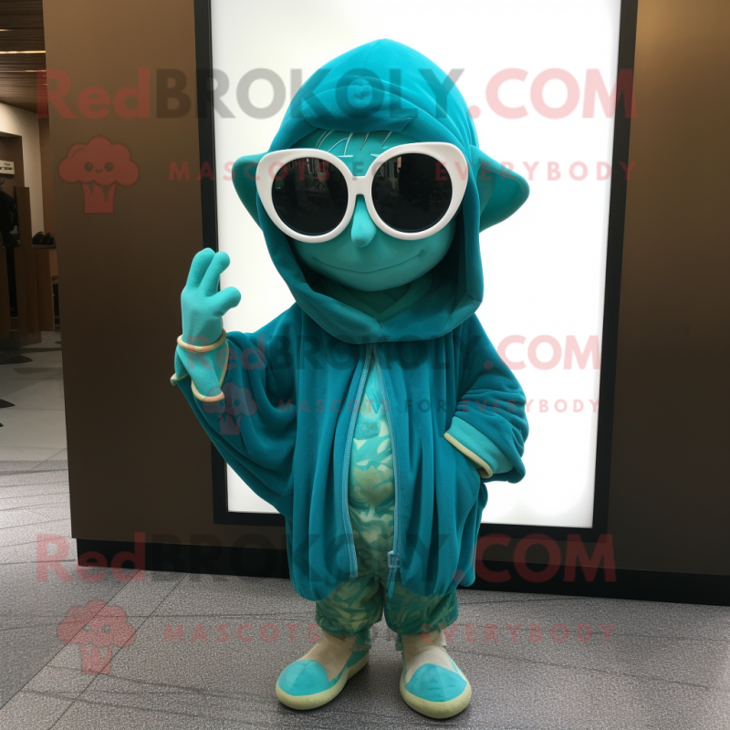 Teal Elf mascot costume character dressed with a Cover-up and Sunglasses