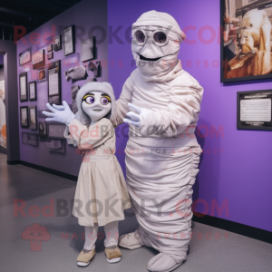 Lavender Mummy mascot costume character dressed with a Poplin Shirt and Watches