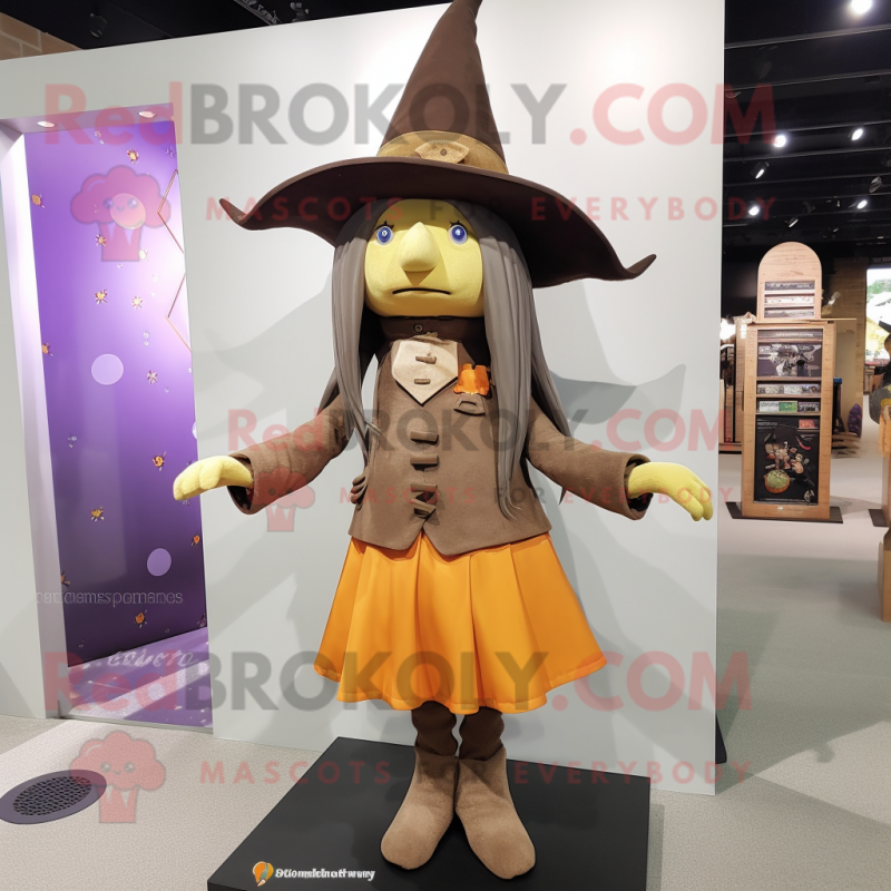 Brown Witch mascot costume character dressed with a Jeggings and Berets