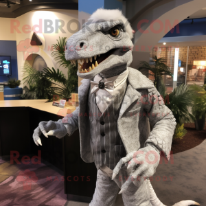 Silver Utahraptor mascot costume character dressed with a Cardigan and Lapel pins