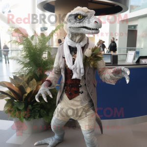 Silver Utahraptor mascot costume character dressed with a Cardigan and Lapel pins