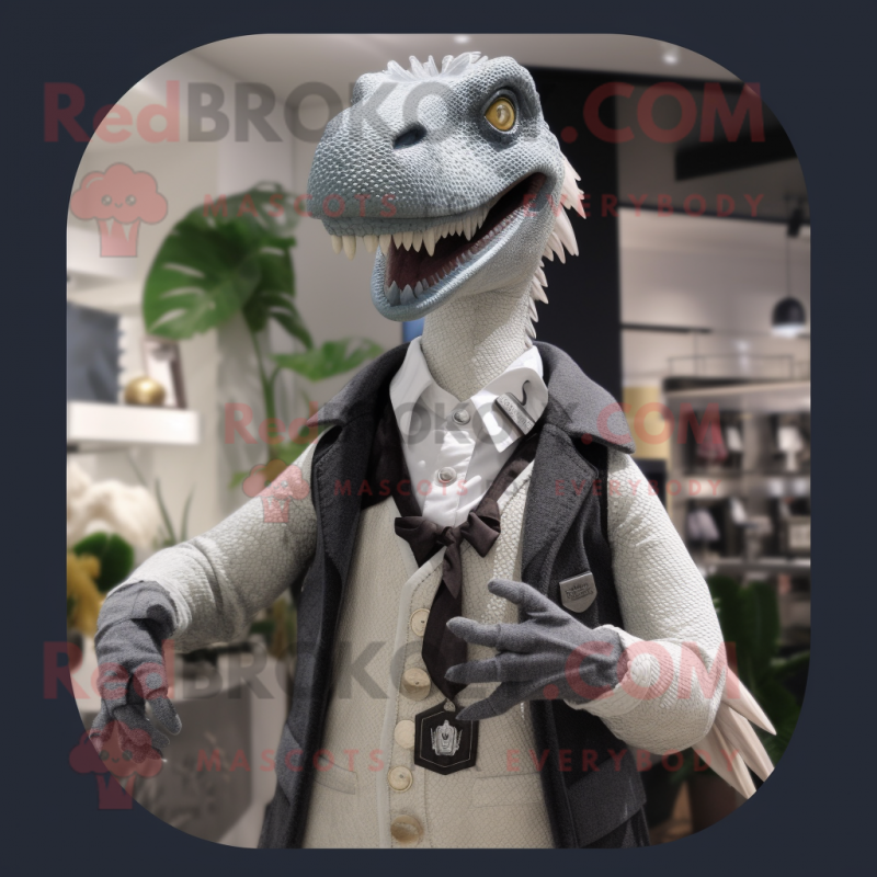 Silver Utahraptor mascot costume character dressed with a Cardigan and Lapel pins