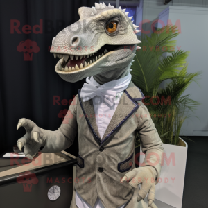 Silver Utahraptor mascot costume character dressed with a Cardigan and Lapel pins