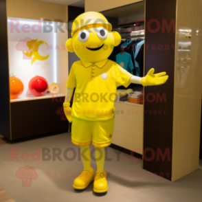 Yellow Plum mascot costume character dressed with a Polo Shirt and Bracelet watches