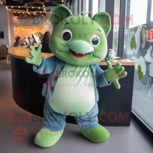 Green Stingray mascot costume character dressed with a Jeans and Mittens