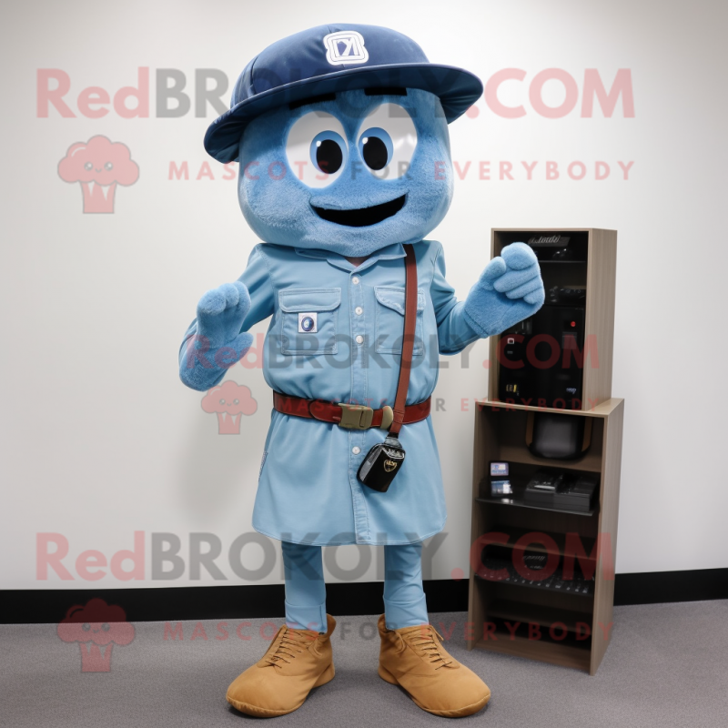 Blue Camera mascot costume character dressed with a Cargo Shorts and Hat pins Blue Camera mascot costume character dressed with a Cargo Shorts and Hat pins