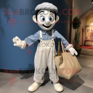 Cream Mime mascot costume character dressed with a Chambray Shirt and Tote bags
