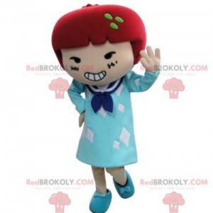 Mascotte de fillette en robe avec les cheveux rouges -