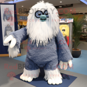 Navy Yeti mascot costume character dressed with a Denim Shorts and Shawl pins