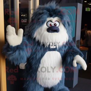 Navy Yeti mascot costume character dressed with a Denim Shorts and Shawl pins