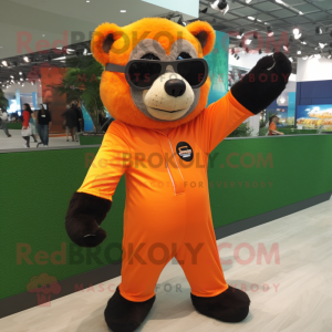 Orange Spectacled Bear mascot costume character dressed with a Jumpsuit and Headbands