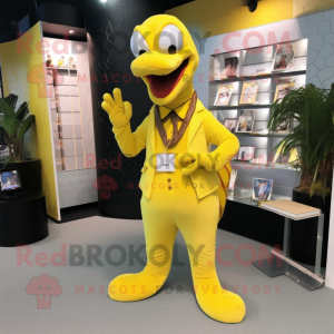 Yellow Titanoboa mascot costume character dressed with a Suit and Clutch bags