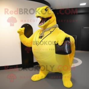 Yellow Titanoboa mascot costume character dressed with a Suit and Clutch bags