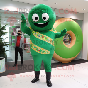Forest Green Donut mascot costume character dressed with a Jumpsuit and Scarves