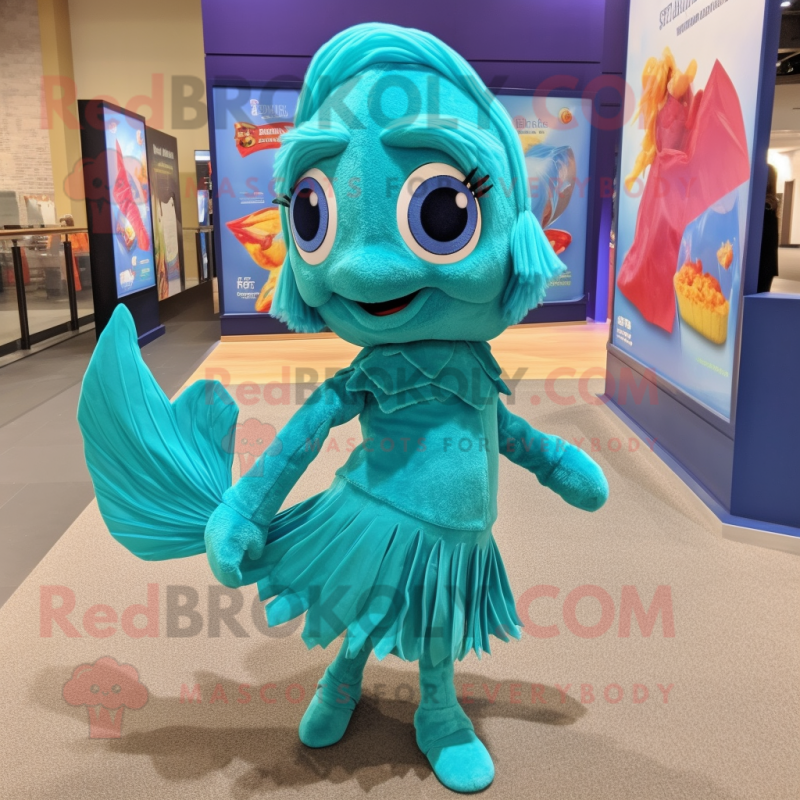 Turquoise Betta Fish mascot costume character dressed with a Shift Dress and Shoe laces