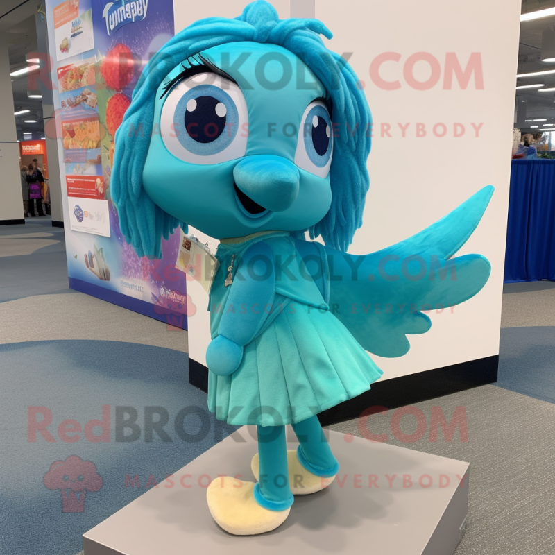 Turquoise Betta Fish mascot costume character dressed with a Shift Dress and Shoe laces Turquoise Betta Fish mascot costume character dressed with a Shift Dress and Shoe laces