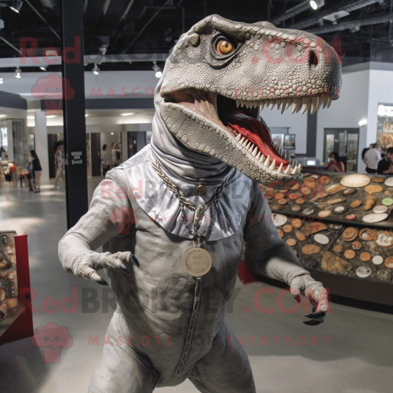 Silver Allosaurus mascot costume character dressed with a Button-Up Shirt and Rings