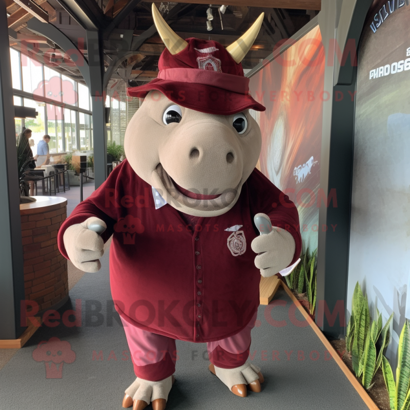 Maroon Rhinoceros mascot costume character dressed with a T-Shirt and Hat pins Maroon Rhinoceros mascot costume character dressed with a T-Shirt and Hat pins