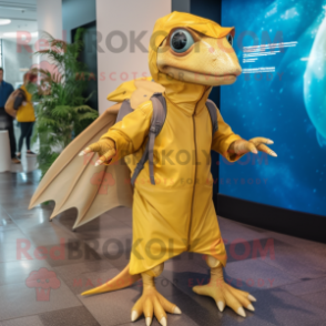 Gold Dimorphodon mascot costume character dressed with a Raincoat and Backpacks