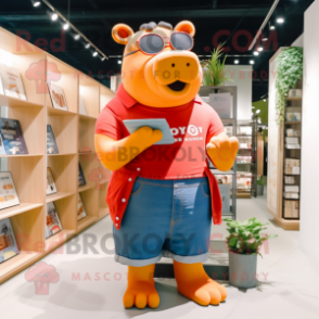 Orange Hippopotamus mascot costume character dressed with a Denim Shorts and Reading glasses