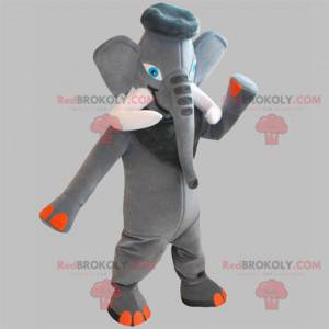 Mascota elefante gris y naranja con grandes colmillos -