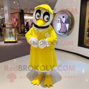 Lemon Yellow Penguin mascot costume character dressed with a Midi Dress and Bracelet watches