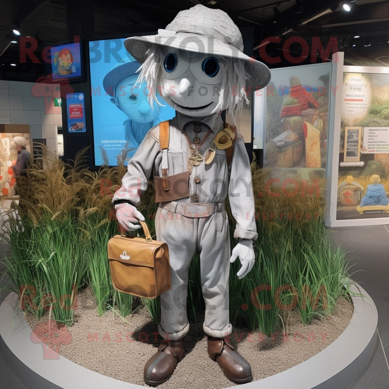 Silver Scarecrow mascot costume character dressed with a Jacket and Messenger bags