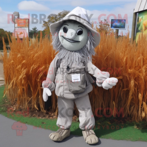 Silver Scarecrow mascot costume character dressed with a Jacket and Messenger bags