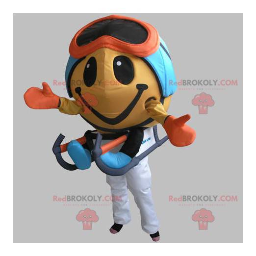 Round snowman mascot with a mask and a sledge - Redbrokoly.com