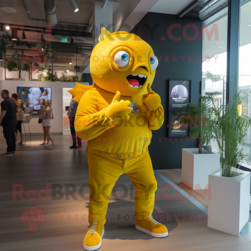 Yellow Piranha mascot costume character dressed with a Jeans and Smartwatches