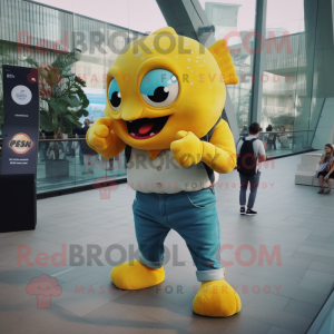 Yellow Piranha mascot costume character dressed with a Jeans and Smartwatches