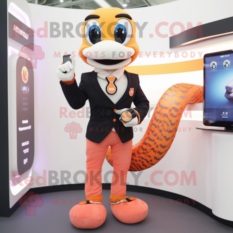 Peach Snake mascot costume character dressed with a Suit Pants and Smartwatches Peach Snake mascot costume character dressed with a Suit Pants and Smartwatches