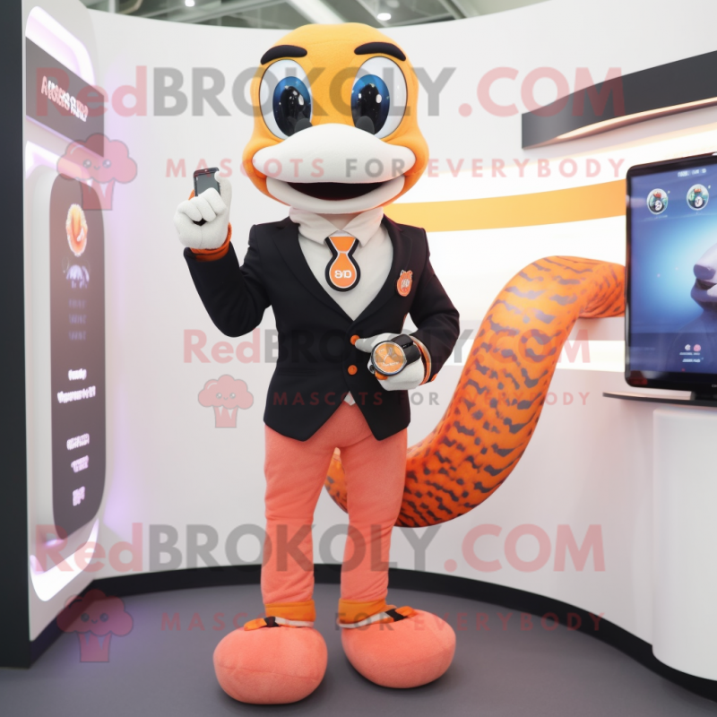 Peach Snake mascot costume character dressed with a Suit Pants and Smartwatches