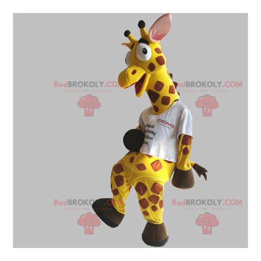 Mascote girafa gigante e engraçada, amarela e marrom -