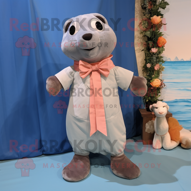 Peach Seal mascot costume character dressed with a Chambray Shirt and Bow ties Peach Seal mascot costume character dressed with a Chambray Shirt and Bow ties