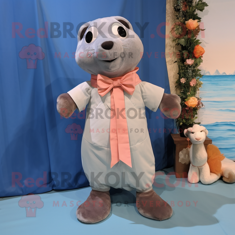 Peach Seal mascot costume character dressed with a Chambray Shirt and Bow ties